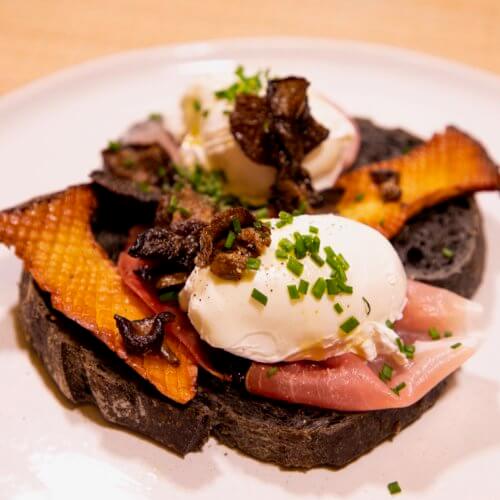 Poached egg, truffle, mushroom and speck brunch